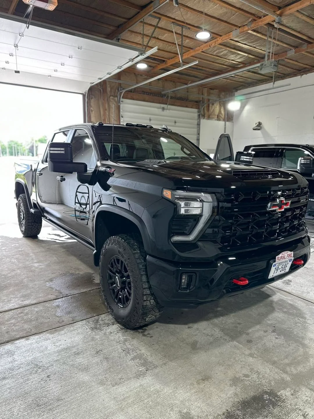 Black Chevrolet Silverado 2500 HD ZR2 pickup truck, front three-quarter view