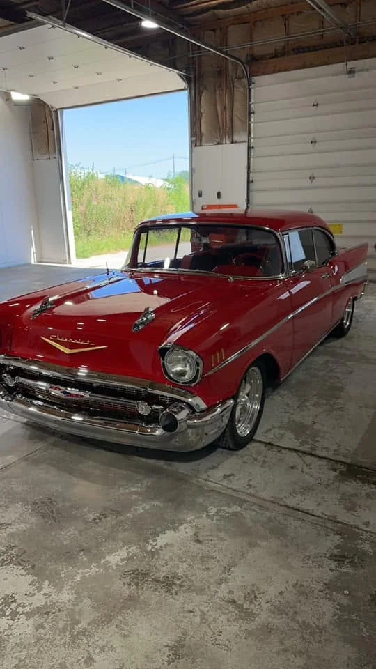 Red 1957 Chevrolet Bel Air, front three-quarter view