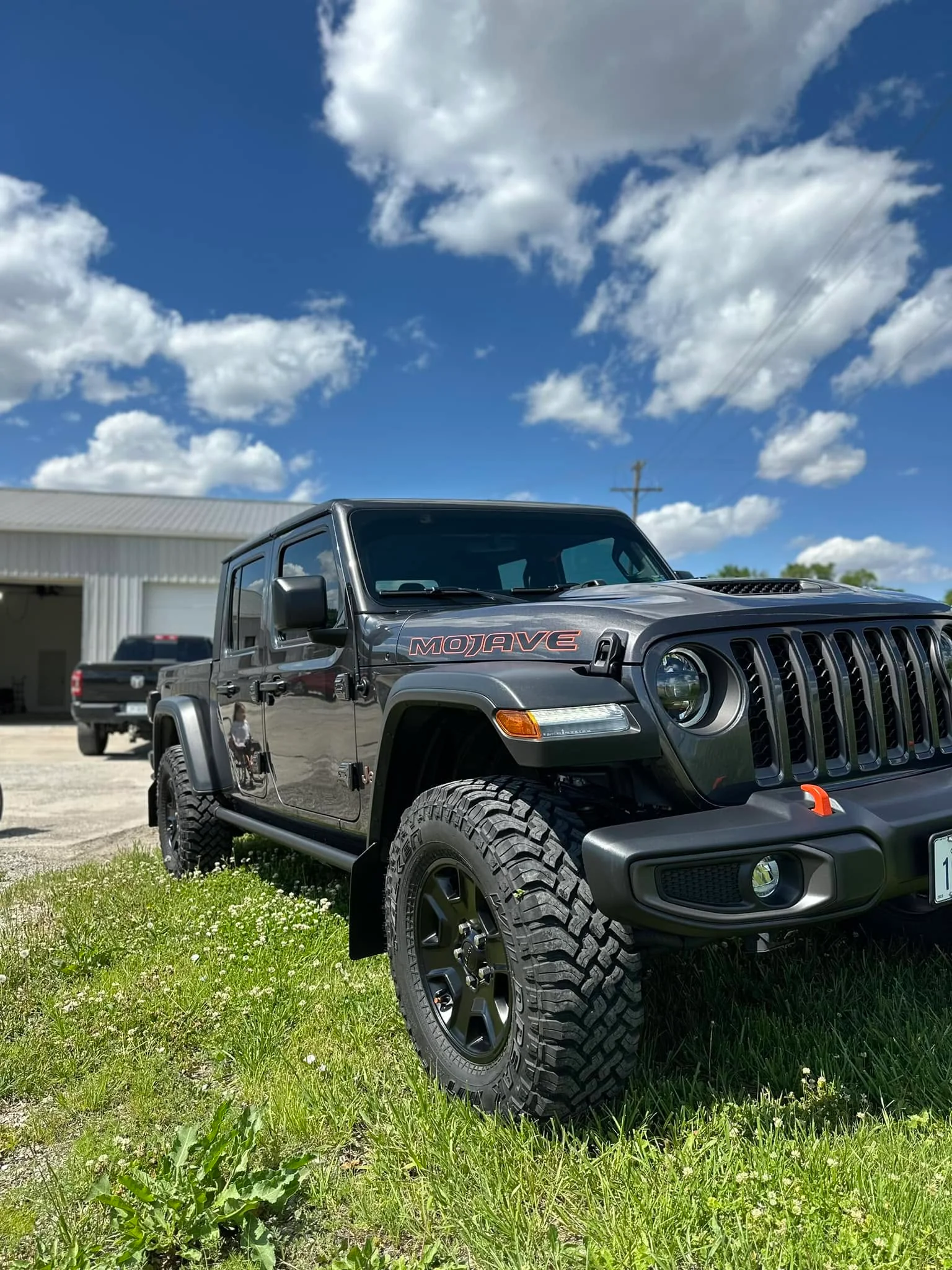Gray Jeep Gladiator Mojave pickup, front three-quarter view