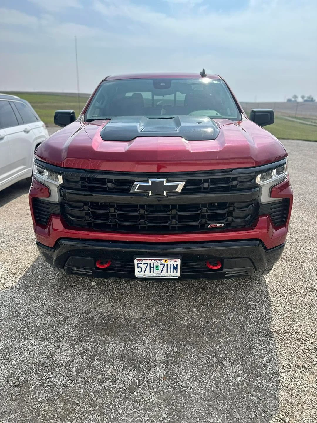 Red Chevrolet Silverado Z71 pickup, front view outdoors