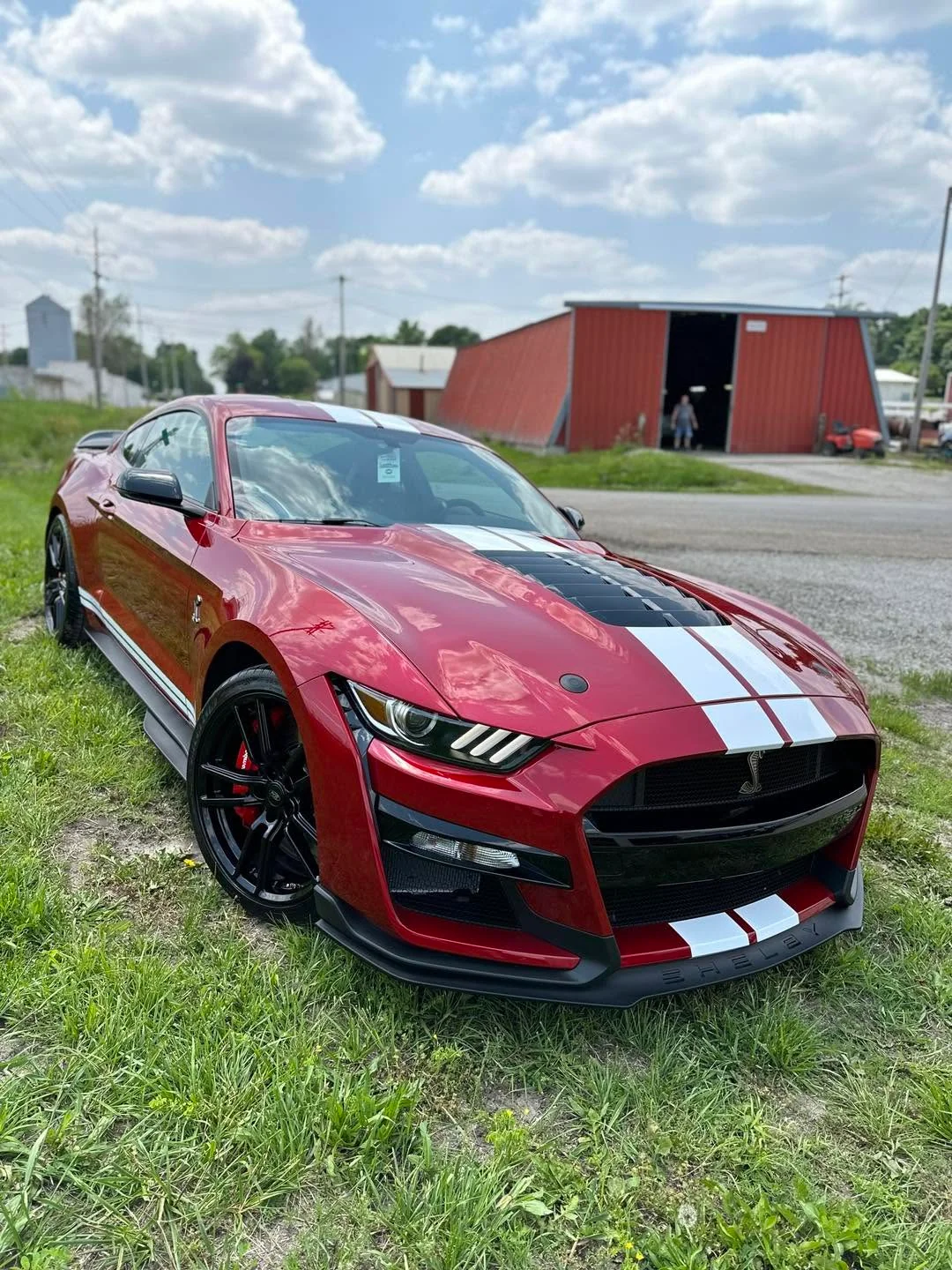 Red Ford Mustang Shelby GT500 coupe, front three-quarter view