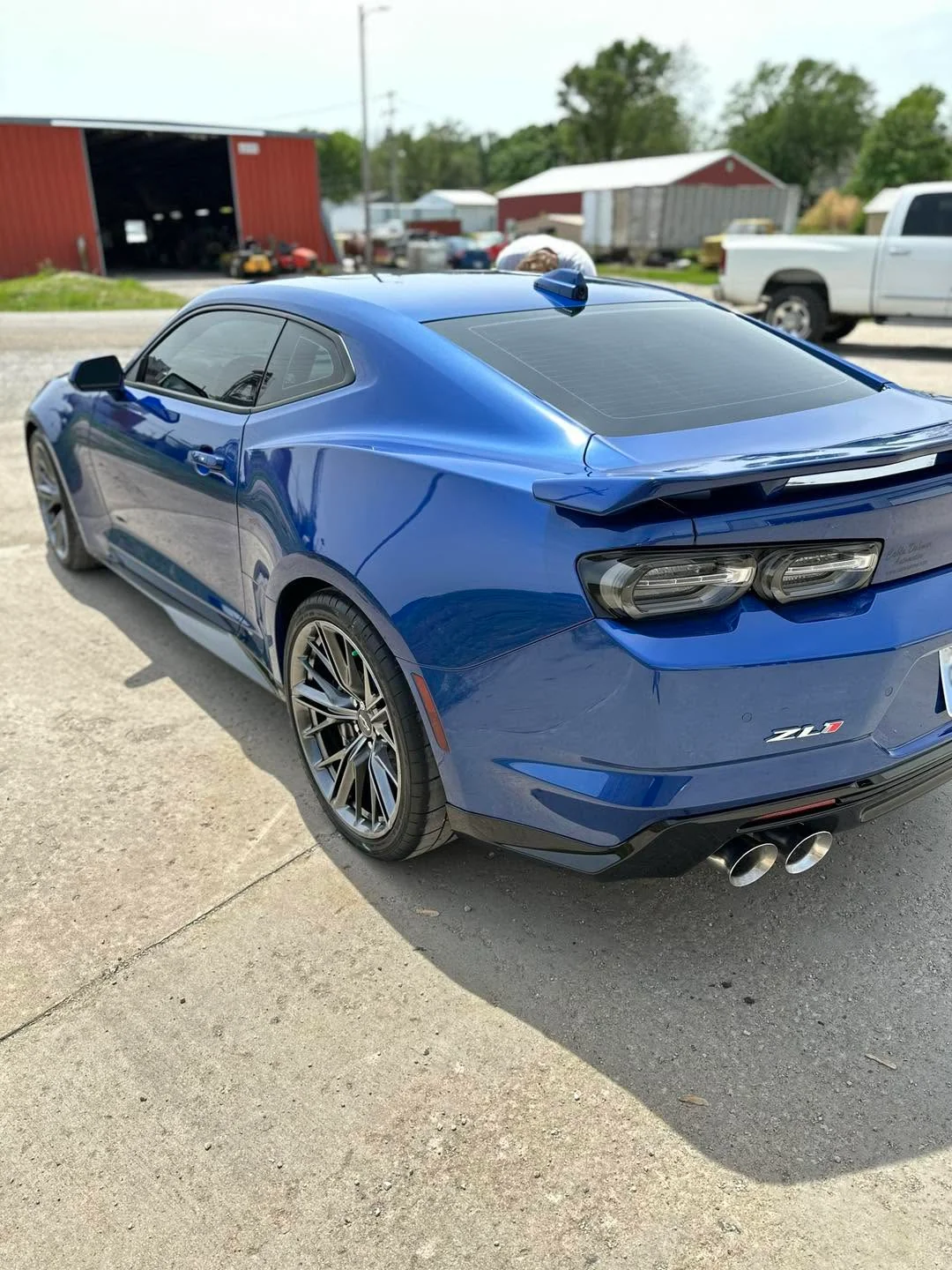 Blue Chevrolet Camaro ZL1 coupe, rear three-quarter view