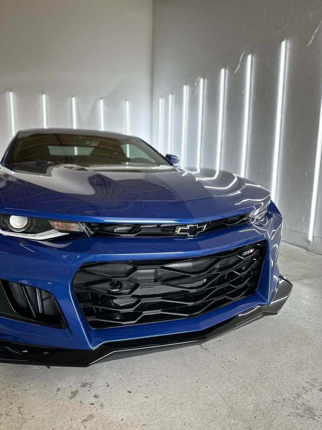 Blue Chevrolet Camaro ZL1 coupe, front grille close-up