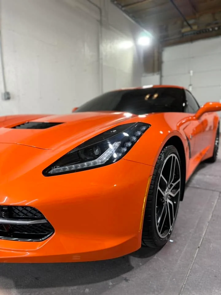 Orange Chevrolet Corvette Stingray, close-up front three-quarter view