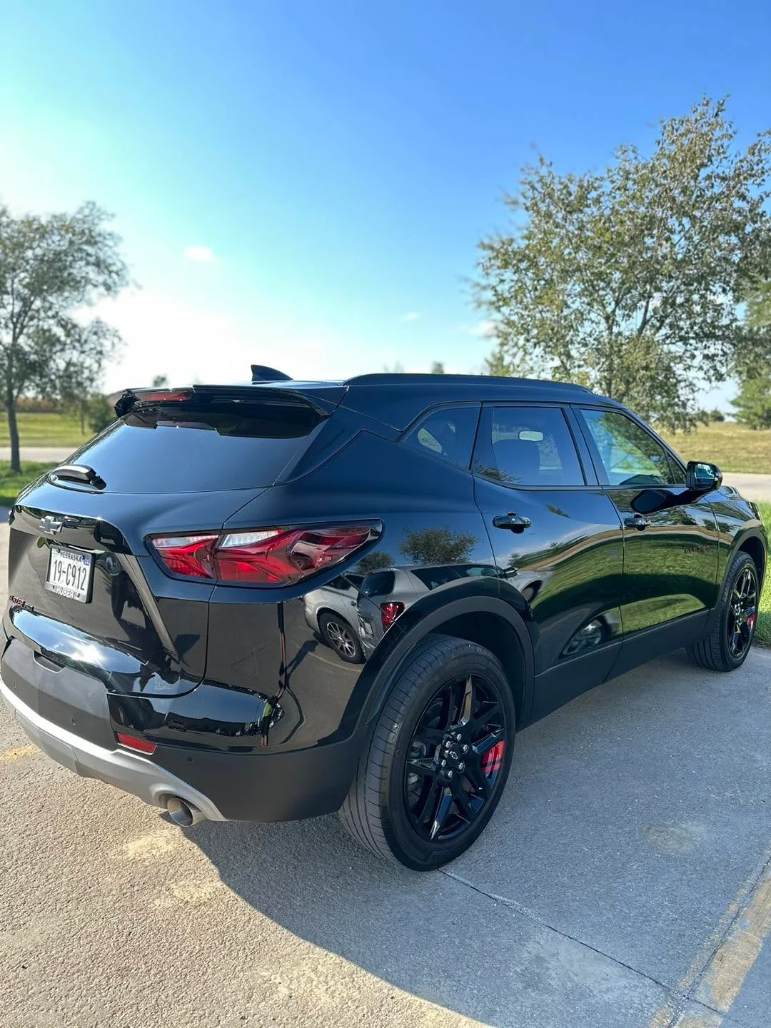 Black Chevrolet Blazer SUV, rear three-quarter view outdoors