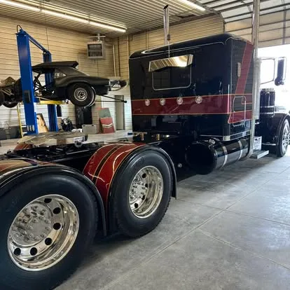 Custom maroon and black Peterbilt semi