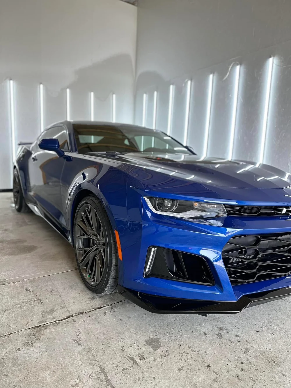 Freshly detailed and ceramic-coated blue Chevrolet Camaro ZL1 with deep gloss finish